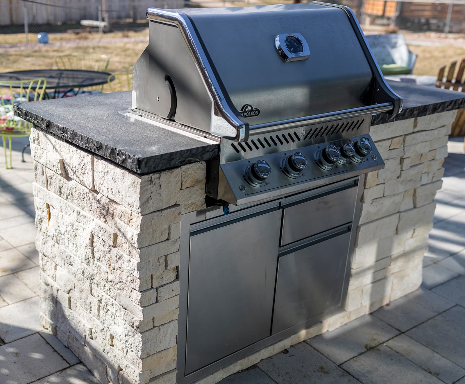 Complete outdoor living space with fire pit and paver patio in Lafayette, Colorado