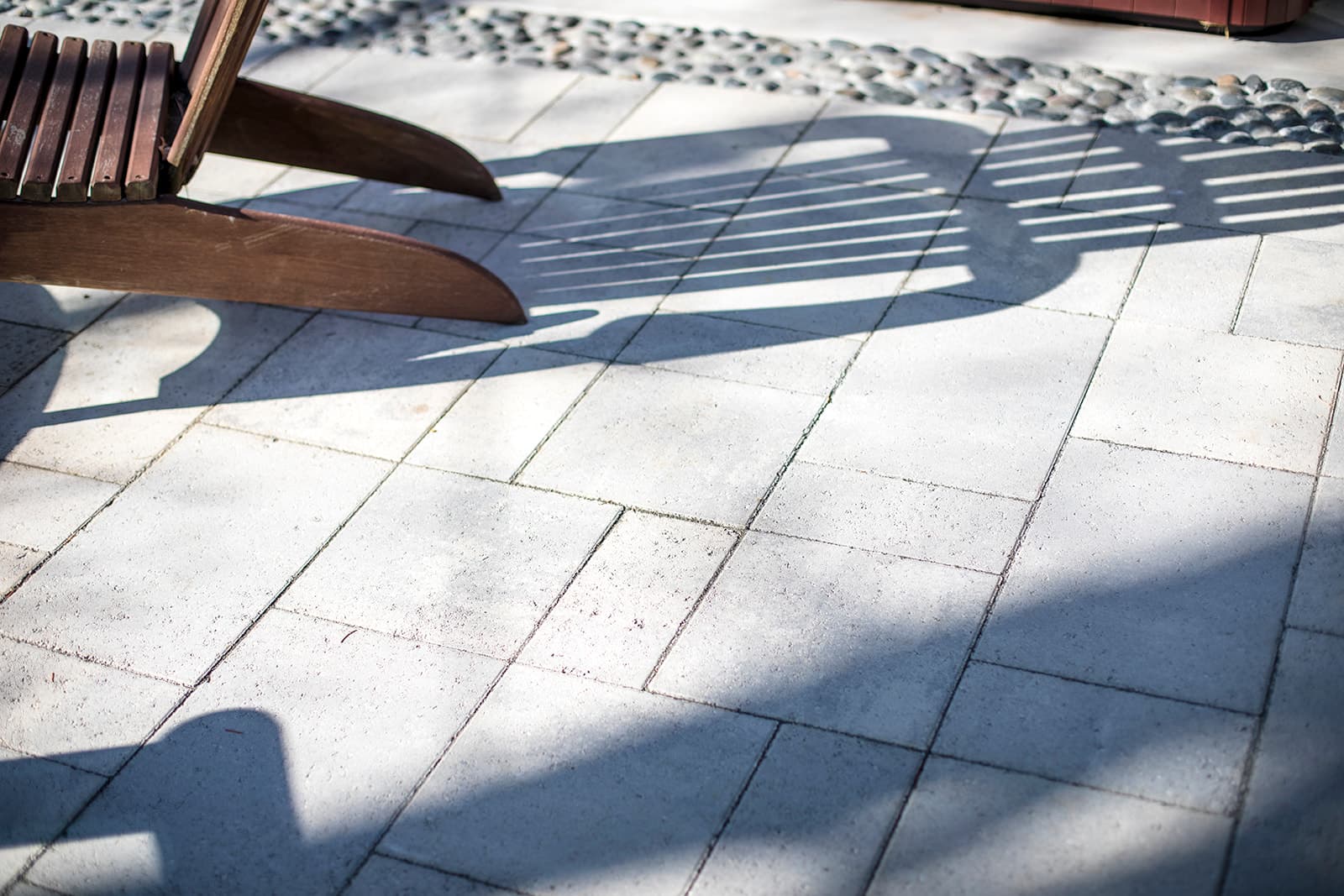 Outdoor kitchen with granite countertops and paver patio in Erie, Colorado